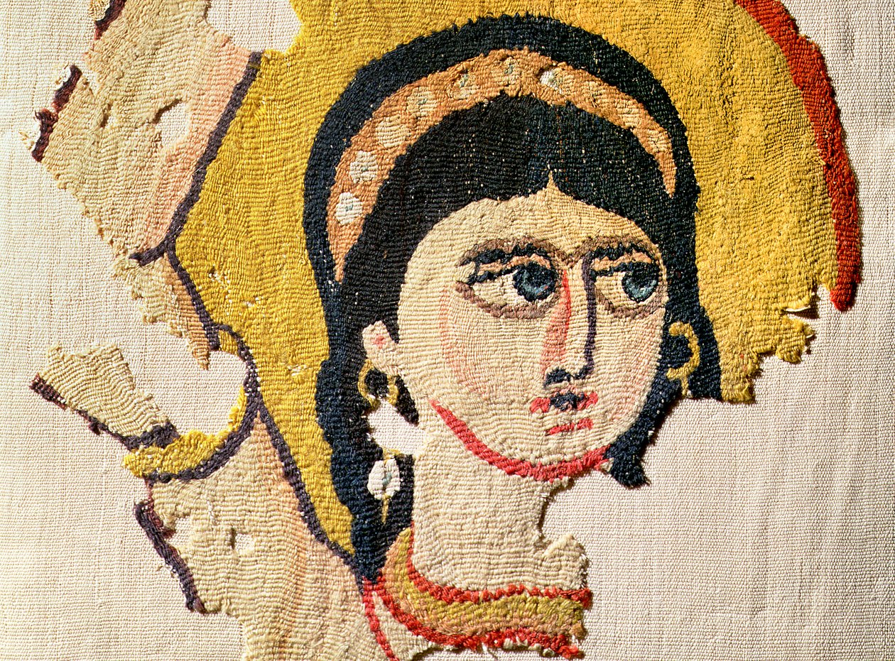 Fragment av en gobeläng föreställande huvudet på en dansare ull- och linnedetalj av 107971 av Coptic