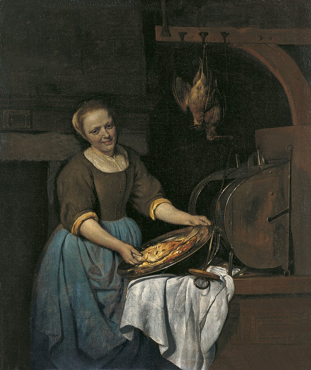 Köksbiträde förbereder fisk av Gabriel Metsu