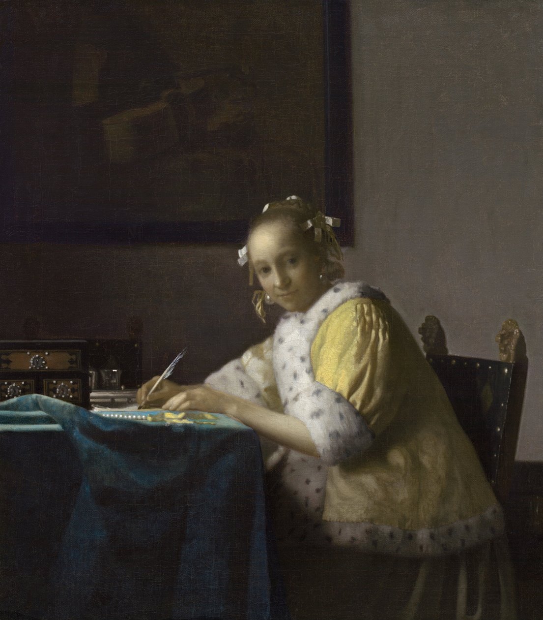 En kvinna som skriver av Johannes Vermeer