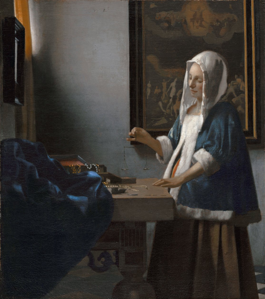 Kvinna som håller en balans av Johannes Vermeer