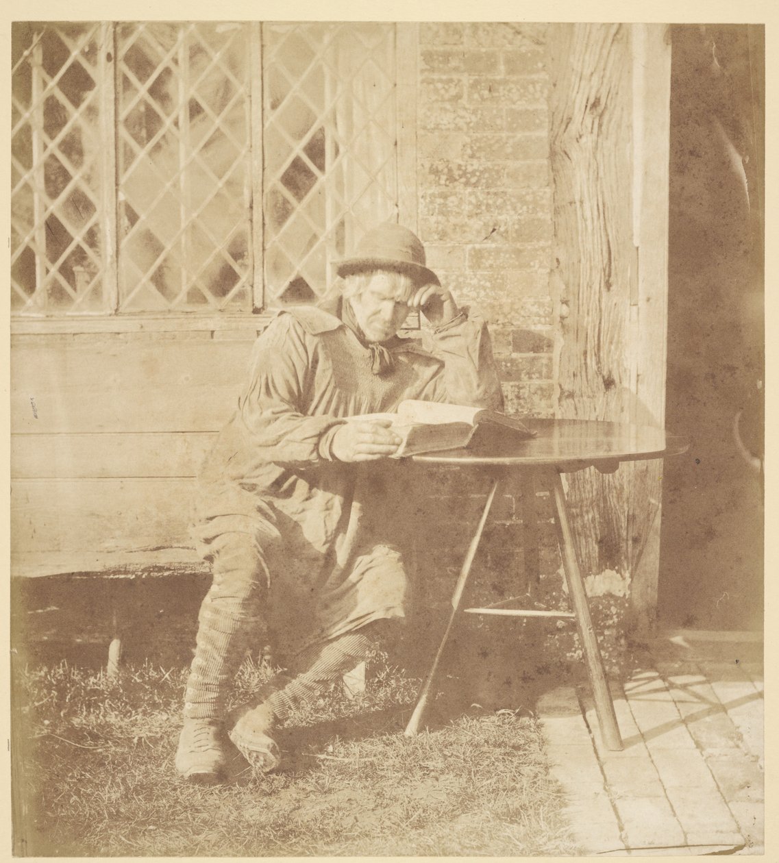 [Man som läser en bok] av John Whistler