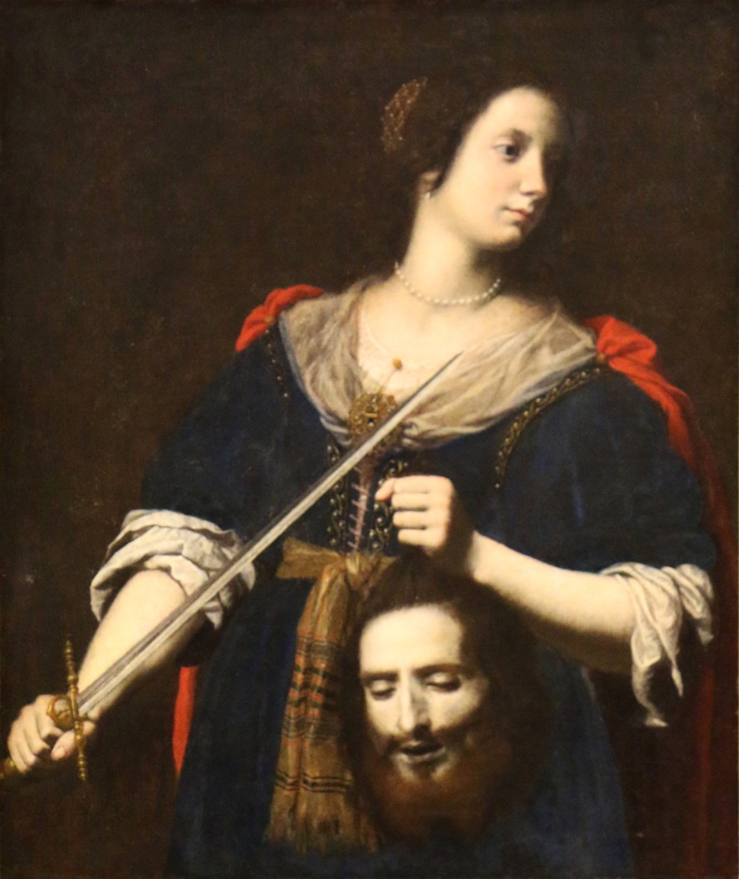 Judith håller Holofernes huvud. av Lorenzo Lippi