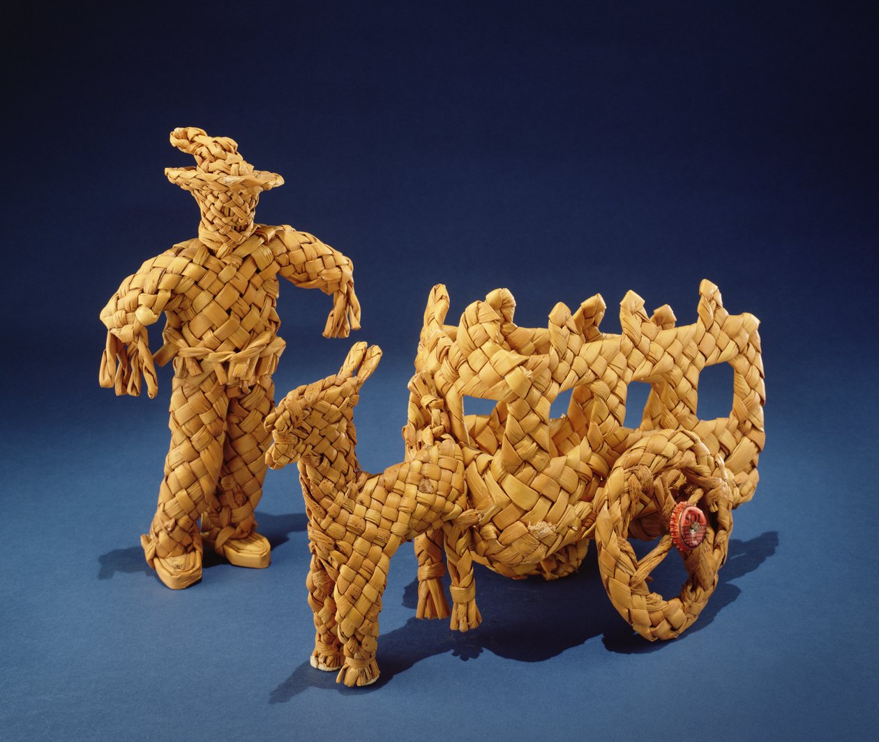 Toy man and cart, från Jalisco (flätade majsskal) av Mexican School