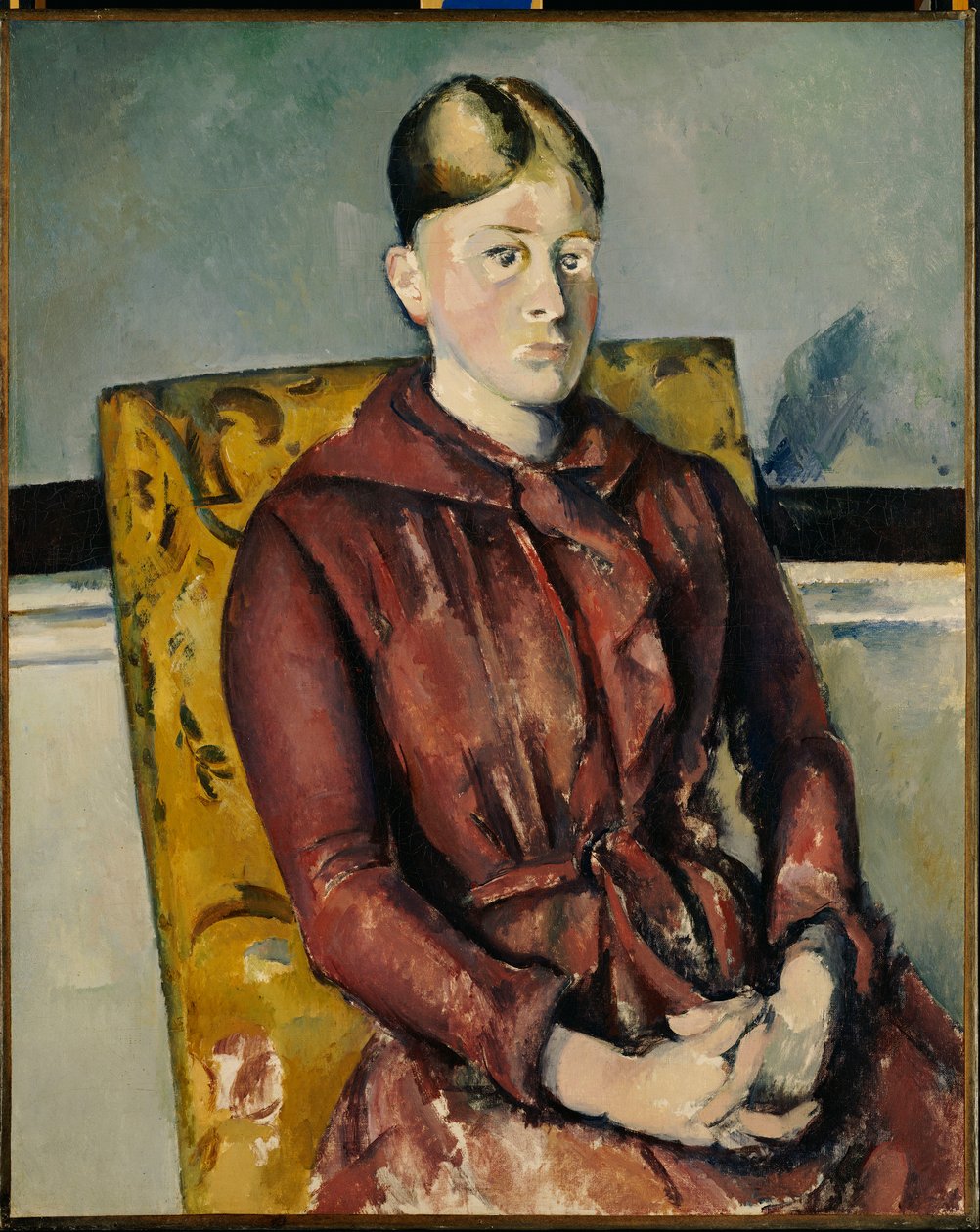 Madame Cezanne med en gul fåtölj av Paul Cézanne