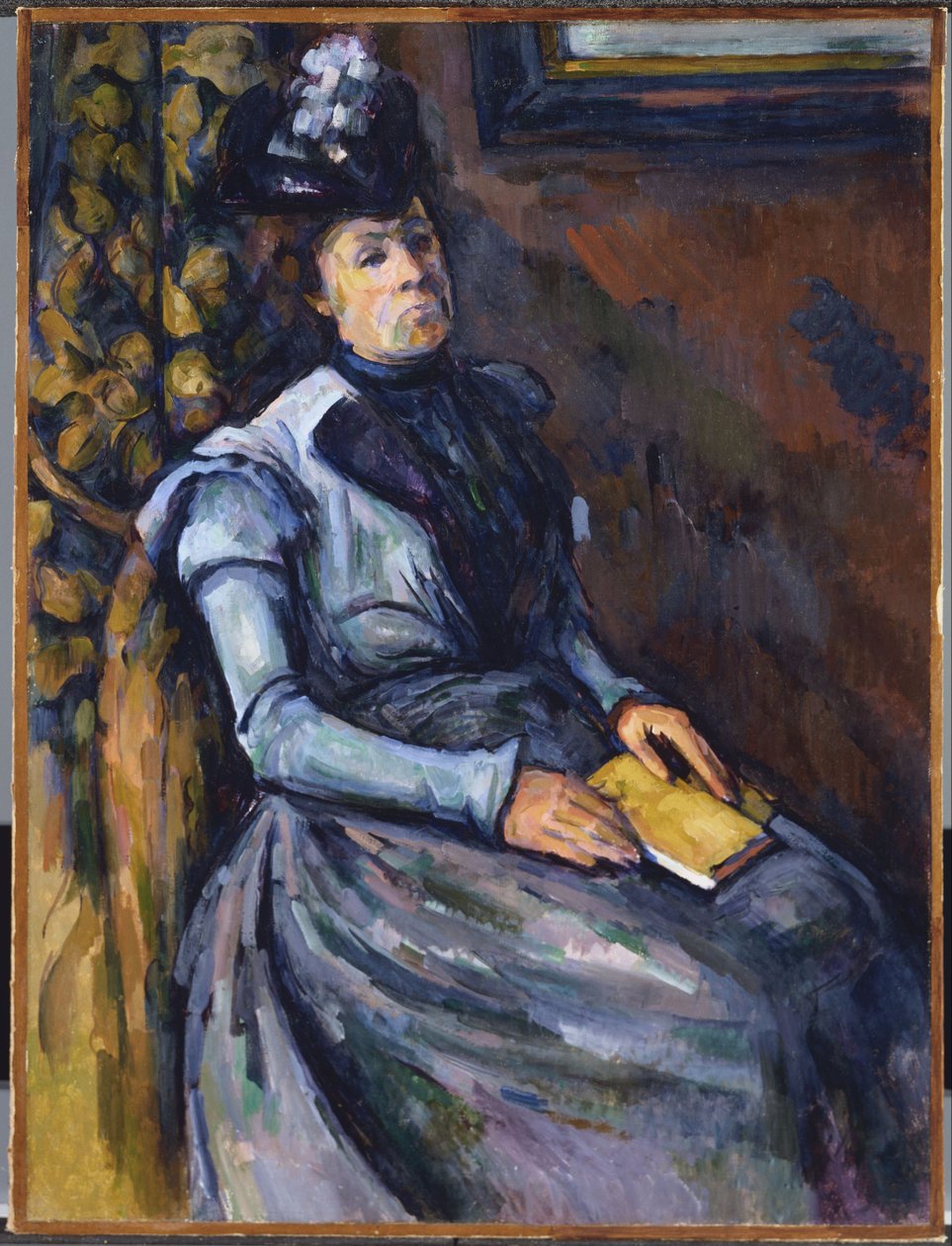 Sittande kvinna i blått av Paul Cézanne