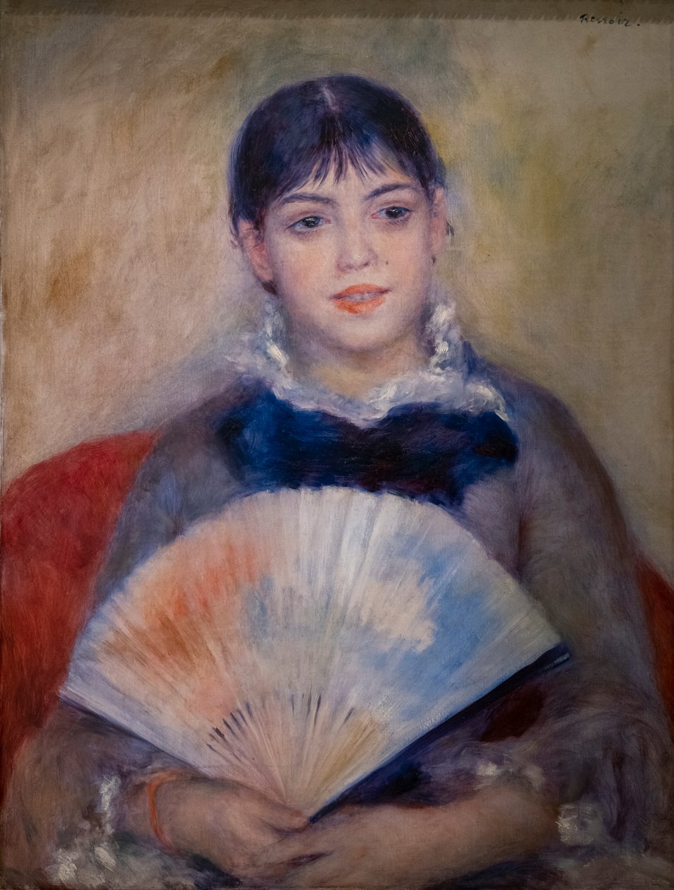 Ung kvinna med en fläkt av Pierre Auguste Renoir