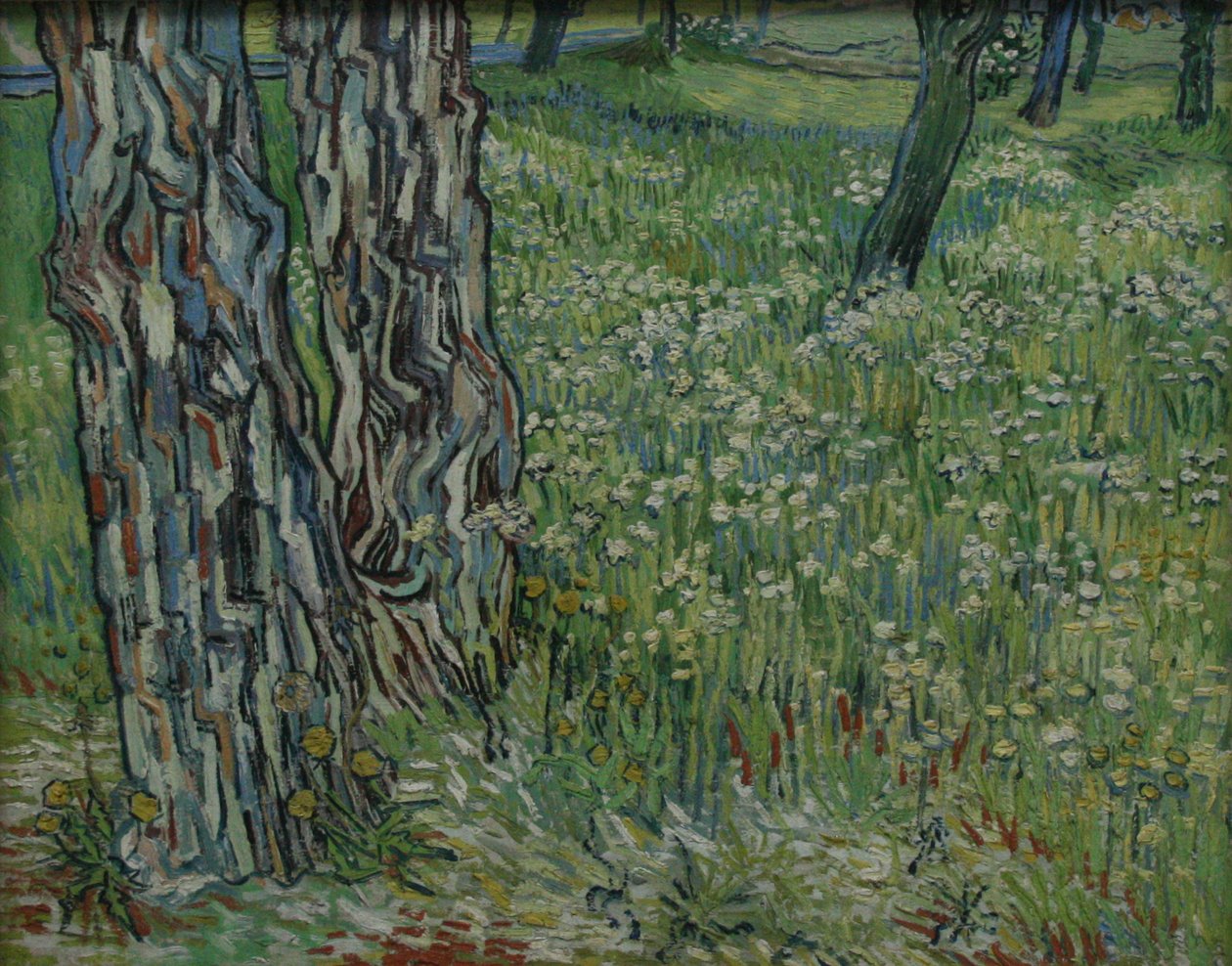 Boomstammen in het gras av Vincent van Gogh