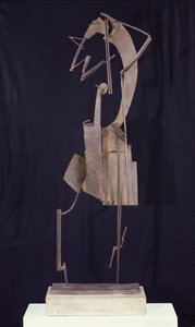 Kvinna som arrangerar sitt hår, 1929-30 (metall)